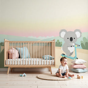 Koala scooter mural wallpaper in modern baby nursery with natural wood furniture by Kids-Mundo