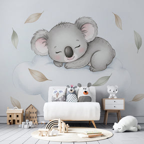 Dreamy koala animal mural wallpaper in toddler room with wooden furniture and soft textiles