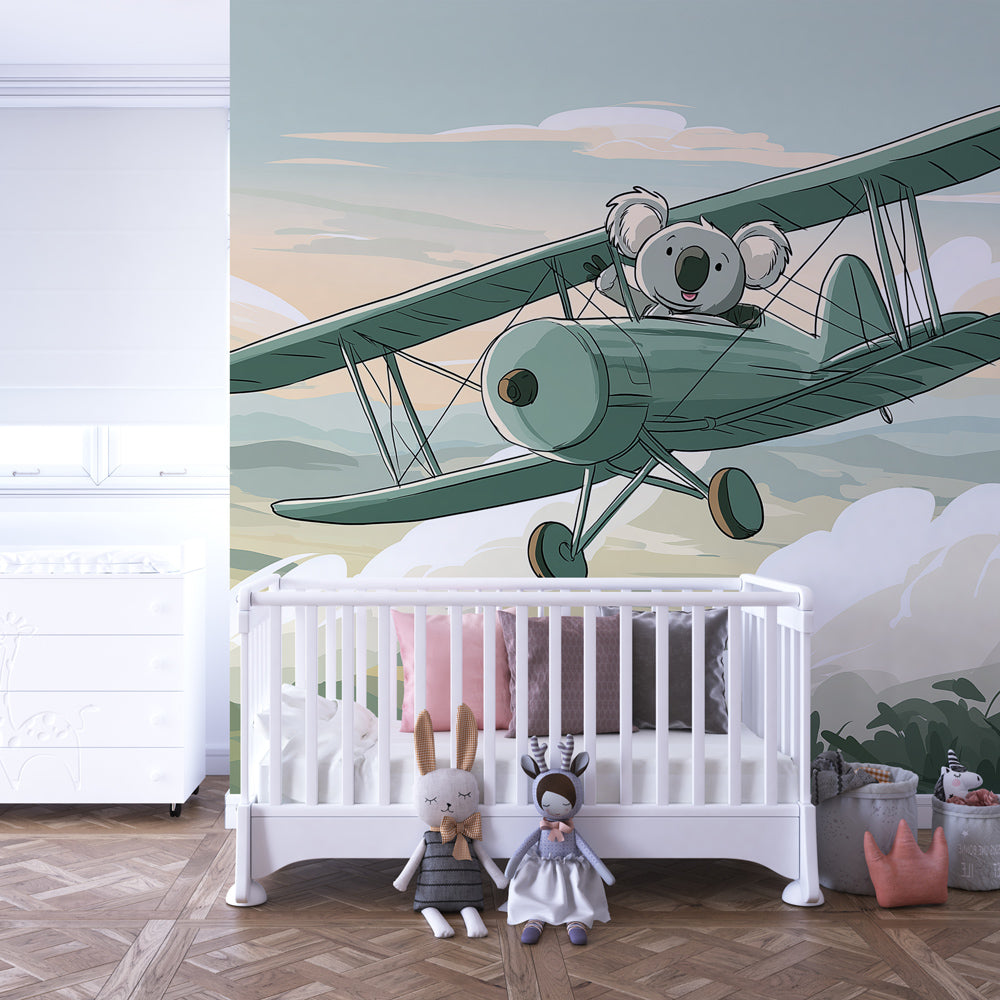 Aviation themed kids bedroom featuring koala airplane mural wallpaper with blue and beige tones
