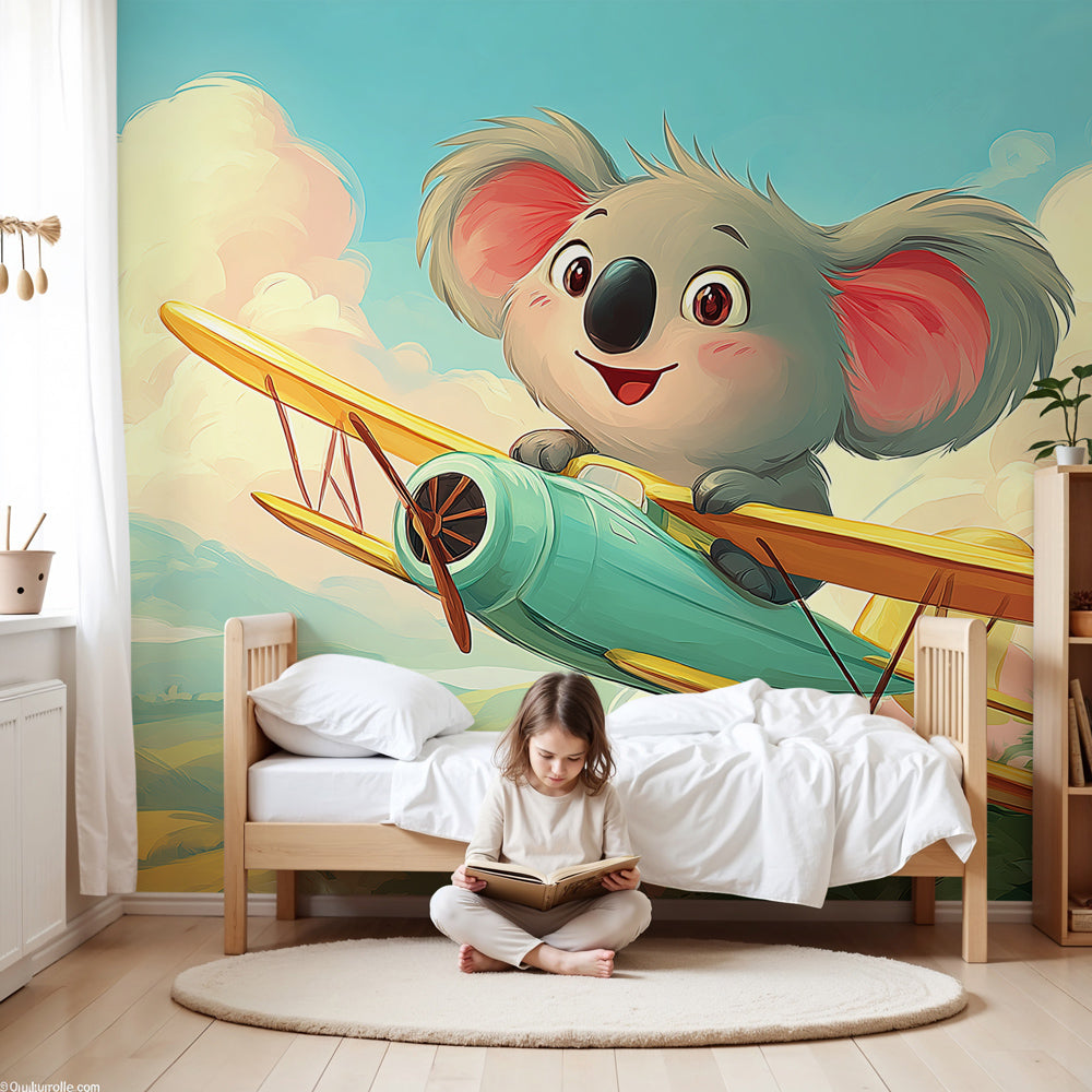 Koala pilot mural wallpaper in modern nursery with wooden crib and blue decor by Kids-Mundo