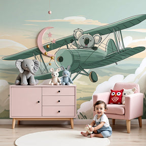 Koala pilot mural wallpaper in modern nursery with white crib and wooden furniture by Kids-Mundo