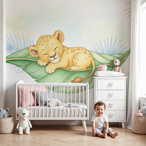 Sleeping leopard mural wallpaper creating serene nursery decor with natural wood furniture by Kids-Mundo