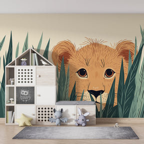 Curious lion cub wallpaper creating adventurous safari theme in children's bedroom decor
