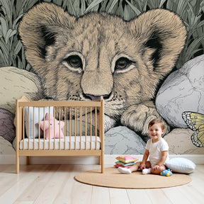Lion cub safari mural wallpaper in modern nursery with natural wood furniture by Kids-Mundo