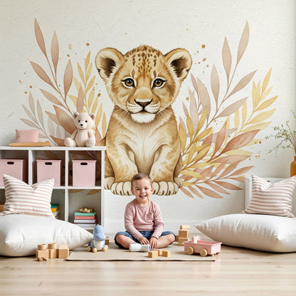 Kids-Mundo watercolour lion cub wall mural styled behind a cot in a soft pastel nursery.