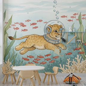 Underwater themed mural wallpaper featuring lion explorer in colorful children's playroom