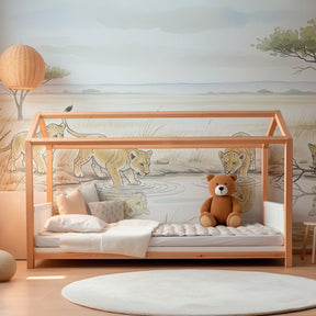 Safari-themed children's bedroom featuring lion cub mural wallpaper with natural earth tones