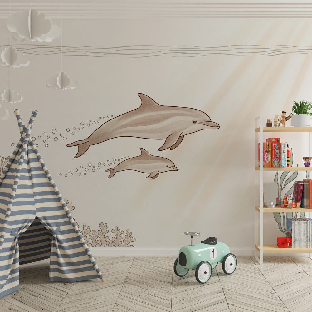 Gentle dolphins mural wallpaper with coral reef creating calming kids playroom atmosphere