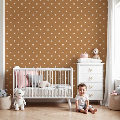 Kids-Mundo mini stars terracotta wall mural styled behind a cot in a cosy nursery