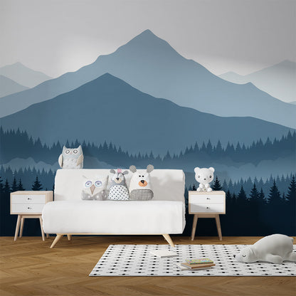 Kids-Mundo layered mountain forest mural on a playroom wall behind toy shelves and a reading corner