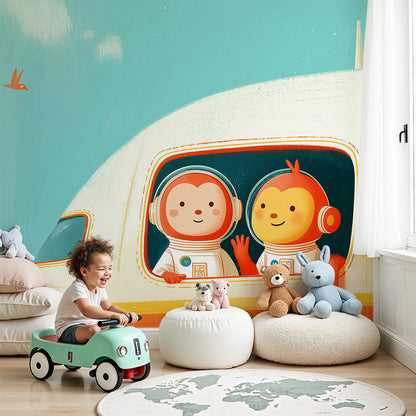 Kids-Mundo monkey and bird astronaut mural styled on a soft teal nursery wall.
