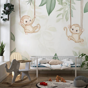 Monkey mural wallpaper with lush tropical leaves for calming baby room atmosphere