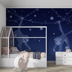 Children's monkey wallpaper with hanging lanterns and stars in cozy kids room setting
