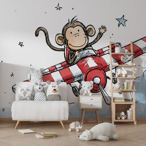 Aviation themed mural wallpaper with monkey pilot transforming children's playroom space