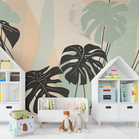 Pastel monstera mural wallpaper in bright children's playroom setting