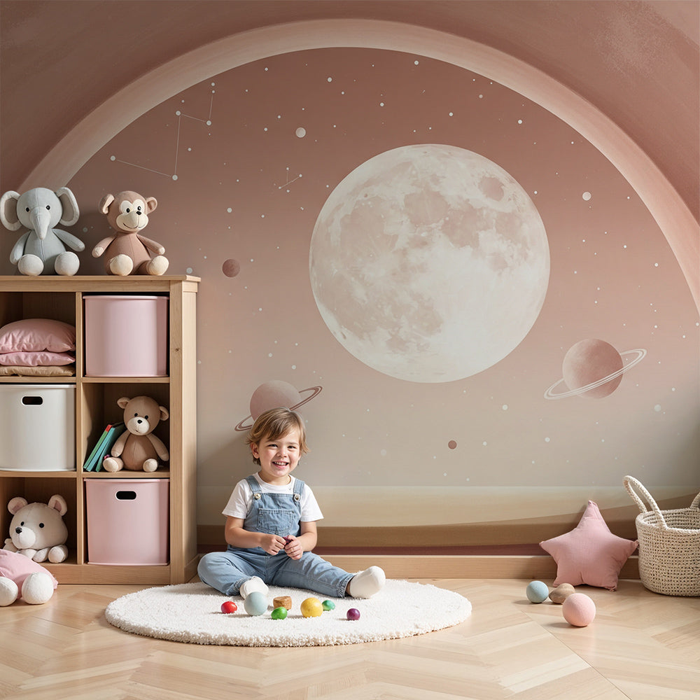 Blush pink moon and planets wall mural by Kids-Mundo styled in a soft, calm nursery interior