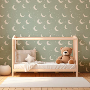 Pale green moon star mural wallpaper transforming toddler room into magical nighttime sanctuary