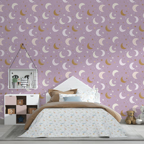 Celestial mural wallpaper with golden moons and stars in modern kids bedroom setting