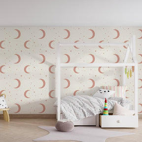Pastel moon and stars wallpaper transforming children's bedroom into magical celestial space