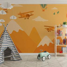 Kids bedroom featuring mountain peaks and airplane wallpaper creating adventure theme