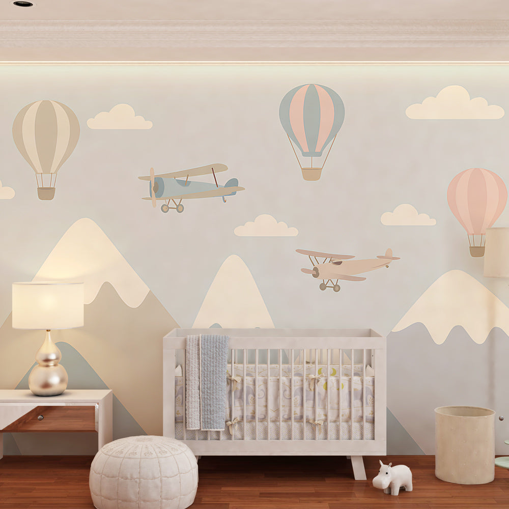 Blue mountain landscape wallpaper creating peaceful kids bedroom decor with aviation theme