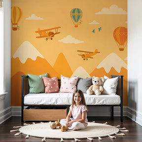 Mountain adventure mural wallpaper with hot air balloons in bright nursery by Kids-Mundo