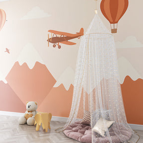 Toddler room decorated with mountain adventure mural wallpaper creating inspiring play space
