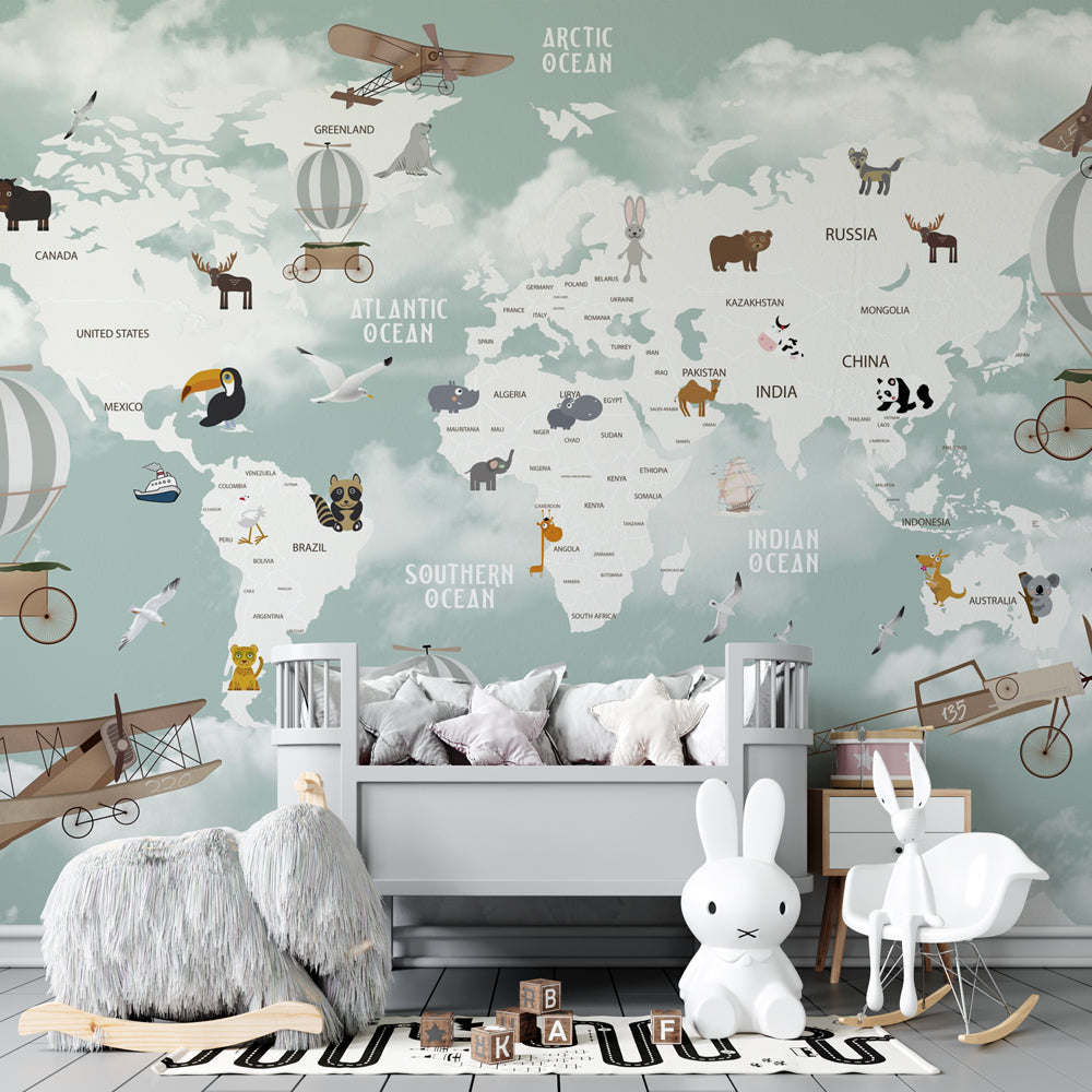 Kids-Mundo animal world map mural on a kids' bedroom wall, orcas and dolphins swimming beneath snowy mountains.
