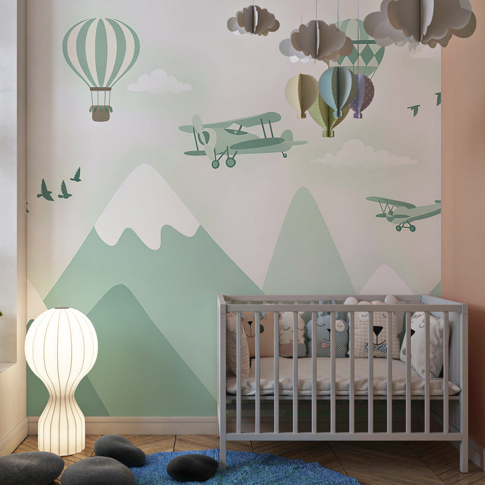 Hot air balloon and mountain wallpaper creating adventurous atmosphere in kids playroom