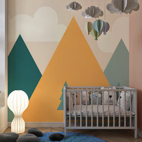Green and orange mountain wallpaper transforming children's bedroom with natural wood furniture