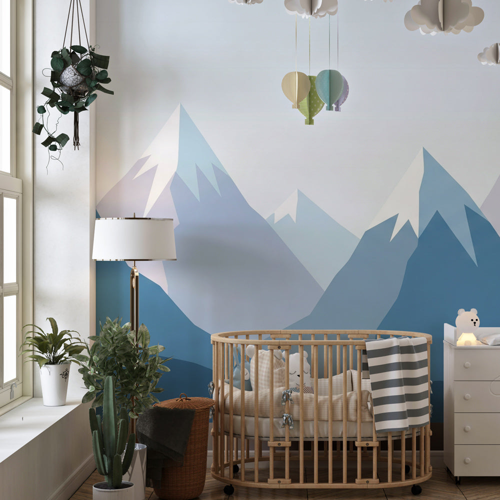 Geometric mountain wallpaper creating serene kids bedroom decor with natural wood furniture