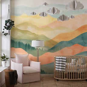 Watercolor mountain wallpaper in modern baby room showing soft pastel tones and peaceful design
