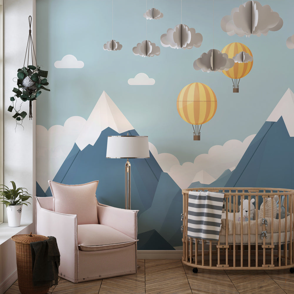 Mountain adventure wallpaper creating dreamy kids bedroom atmosphere with blue peaks