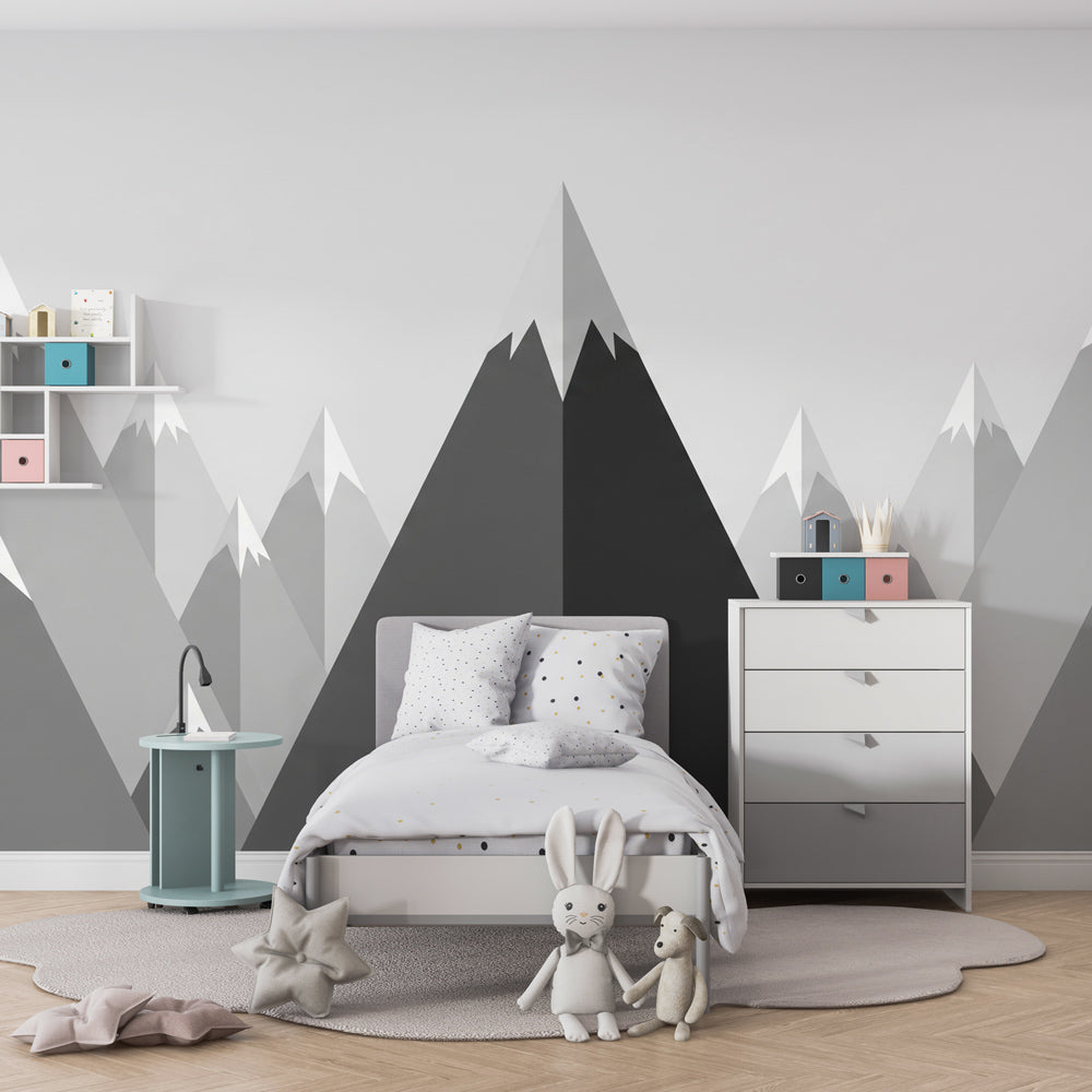 Monochrome mountain wallpaper creating serene children's bedroom decor with natural wood accents