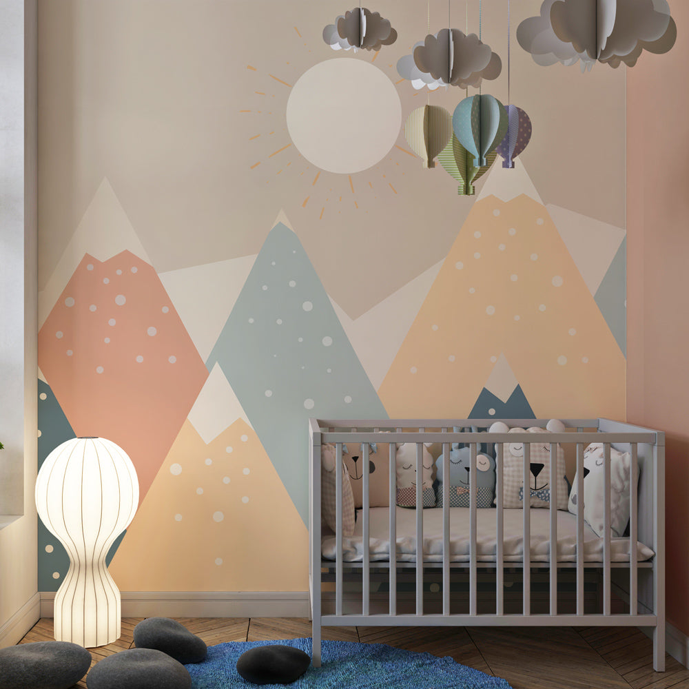Mountain mural wallpaper with soft colors and snowflakes in cozy kids room setting