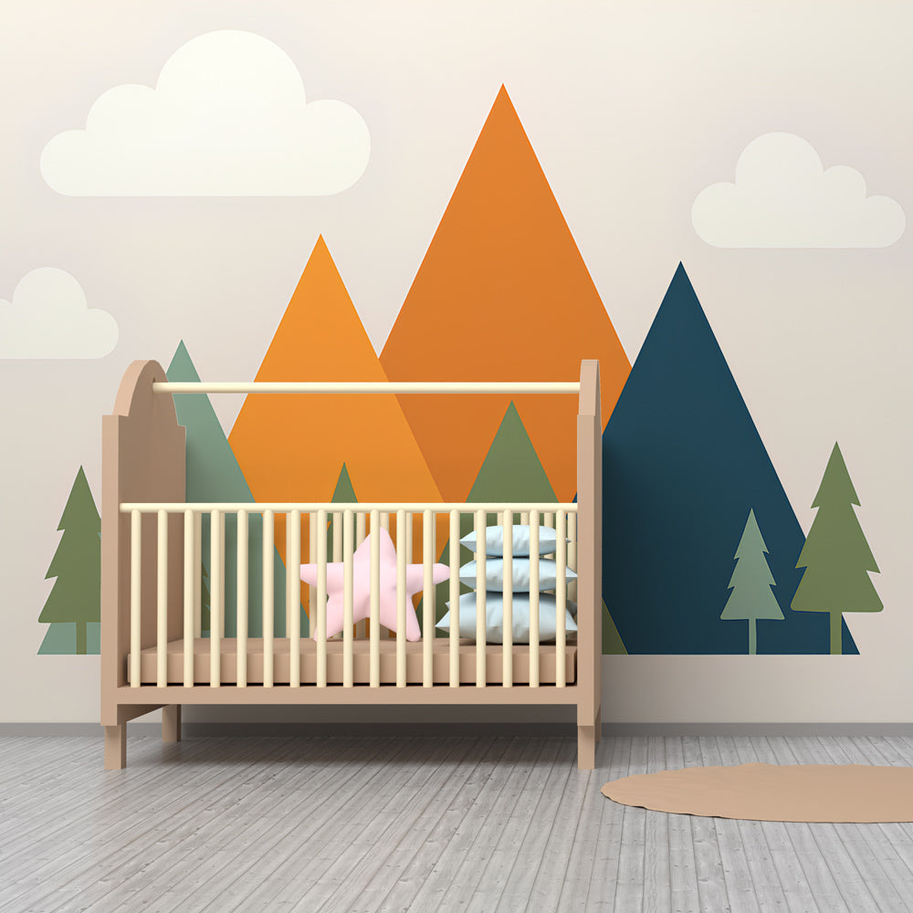 Mountain landscape wallpaper creating adventure-themed nursery with pine trees and clouds