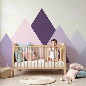 Pastel mountain mural wallpaper with pine trees creating serene nursery decor by Kids-Mundo