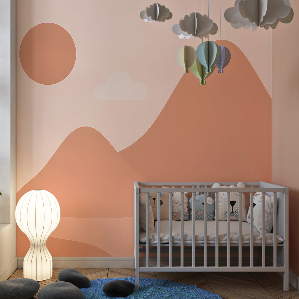Pink mountain wallpaper in children's playroom with cozy reading corner and soft lighting