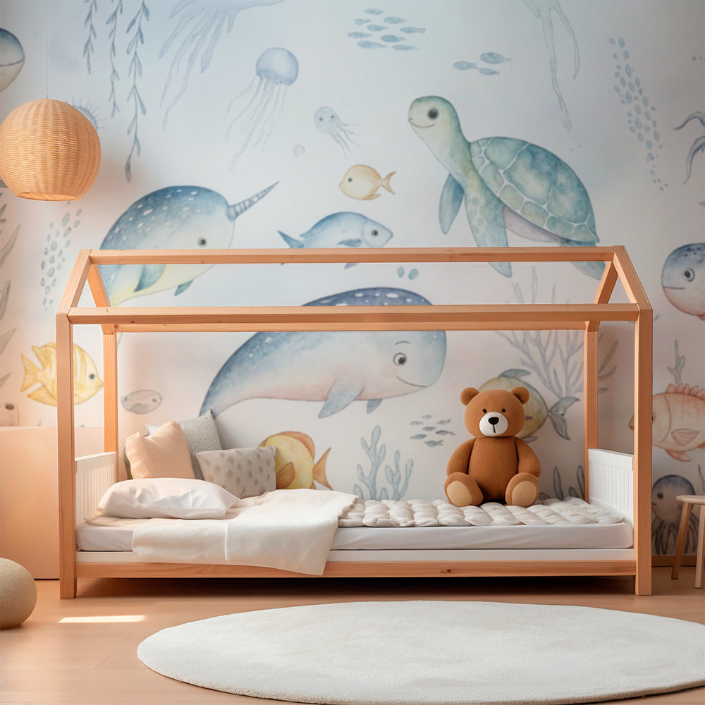 Kids-Mundo ocean animals wall mural featuring narwhals and fish in a bright children's playroom