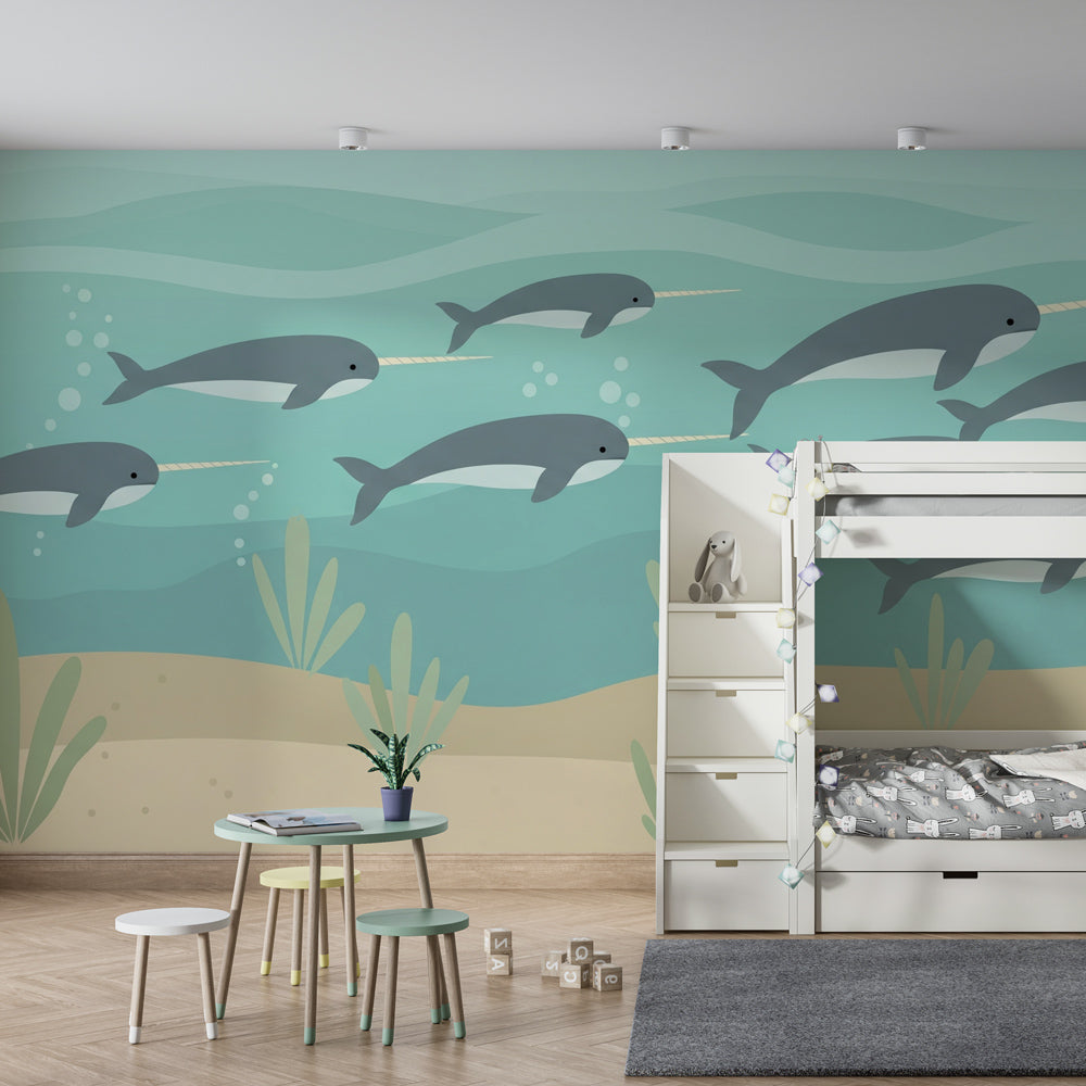 Marine life mural wallpaper featuring swimming narwhals in turquoise ocean playroom setting