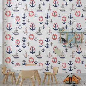 Ocean themed wallpaper creating peaceful nursery with blue boats and anchor motifs