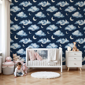 Night sky mural wallpaper with soft clouds and silver moons in peaceful nursery by Kids-Mundo
