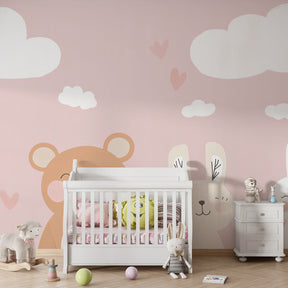 Soft pink nursery wallpaper creating serene baby bedroom with floating hearts and clouds