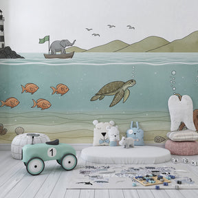 Colorful ocean animal wallpaper featuring elephant and sea creatures in children's playroom
