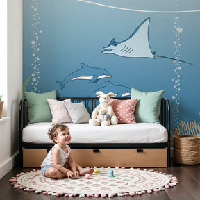 Ocean animals mural wallpaper with dolphins and rays in modern kids bedroom by Kids-Mundo