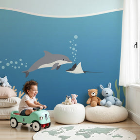 Ocean animals mural wallpaper with dolphin and ray in modern nursery room by Kids-Mundo