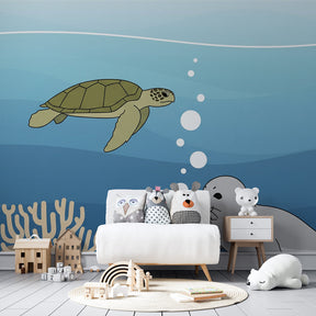 Marine life mural wallpaper featuring turtle and seal in coastal themed kids room