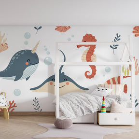 Marine adventure wallpaper in children's playroom featuring colorful sea creatures