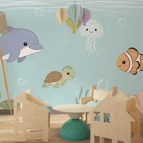 Sea life mural wallpaper transforming children's playroom into aquatic wonderland with colorful fish