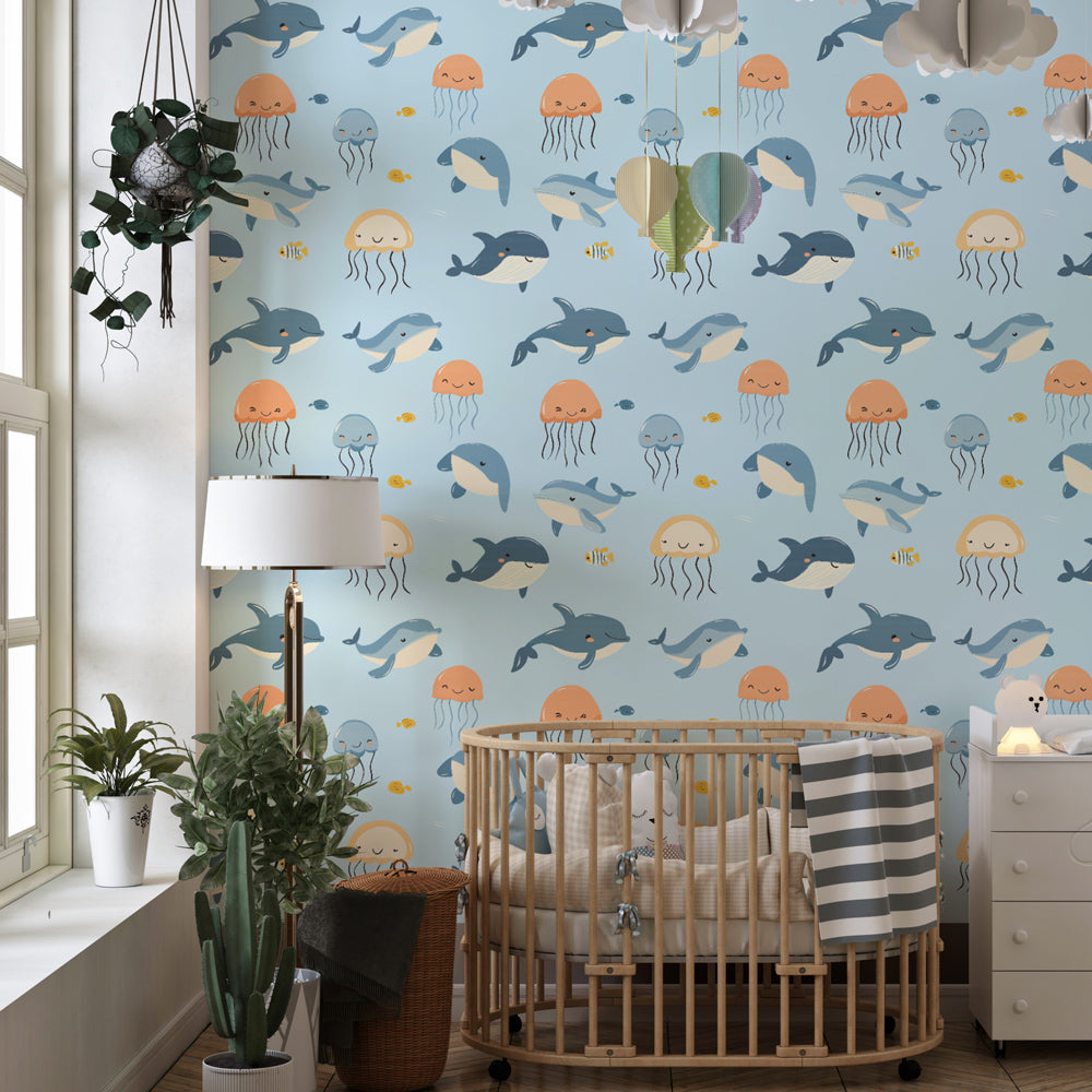 Dolphins and jellyfish wallpaper transforming playroom into aquatic adventure space